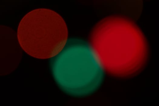 Blurred colored lights background. Lens bokeh backdrop. Flare color lights overlays. Abstract bright blurred colored bokeh. photo