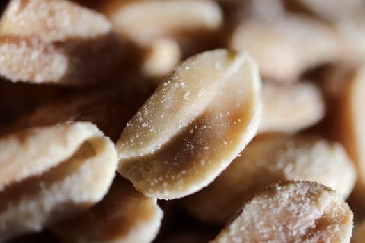 A handful of salted peanuts background. Macro closeup. photo