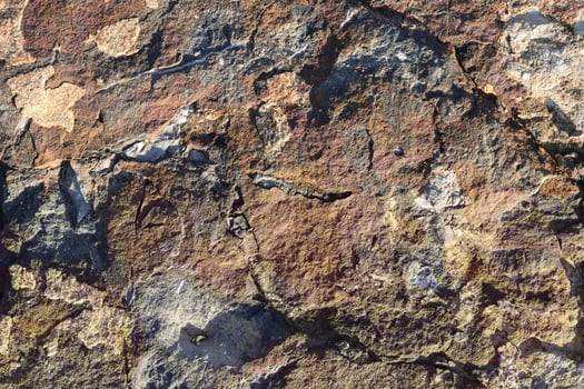Rough bust fractured stone texture material macro closeup. photo