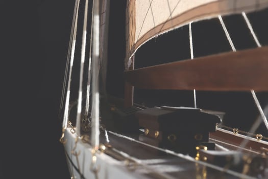 Port side of a yacht model on a black background. photo