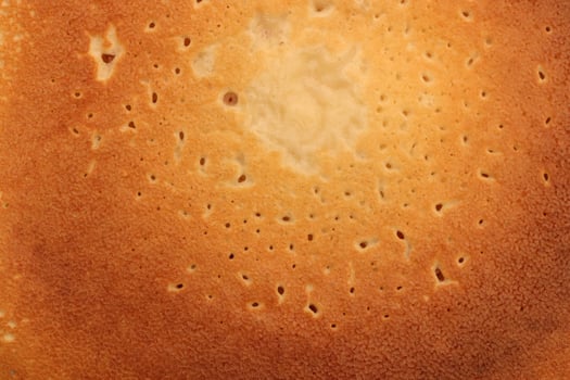 Backed traditional desert pancake pattern texture. Macro closeup. photo