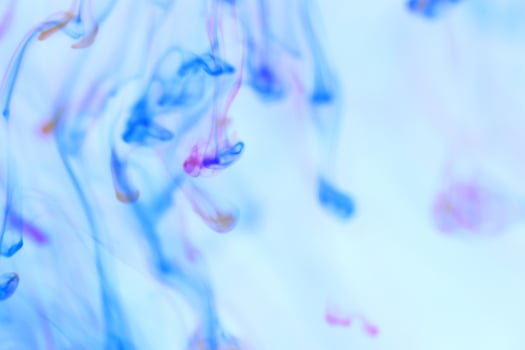Falling Ink Drops Motion Dynamic in Water Liquid Fantasy. Soft Ambient Background. photo