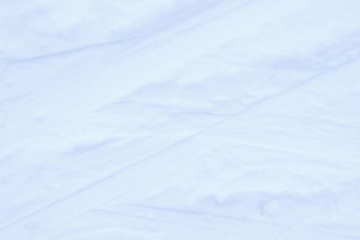 Ski run traces background. Snow skiing track surface. Ski trail texture. photo