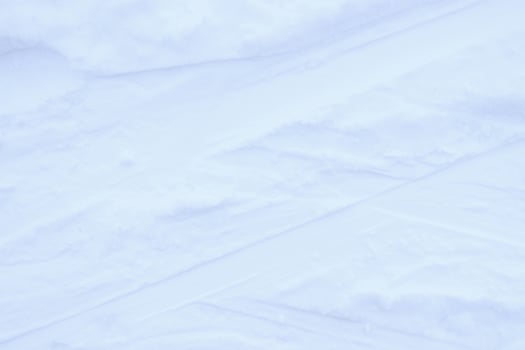 Snow skiing track surface. Ski trail texture. Ski run traces background. photo