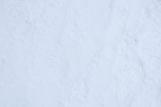 Snow boots tracks surface. Ski boots texture. Shoe sole traces background. photo
