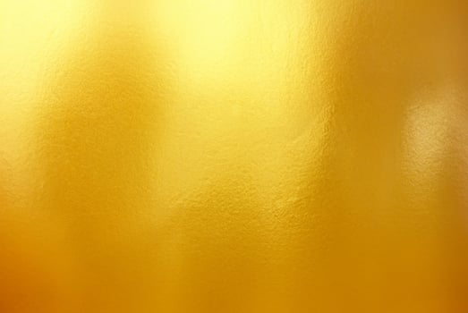 High-Quality Gold Polished Metal Steel Texture Background photo