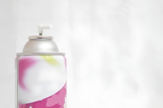 A can of spray paint with a white background photo