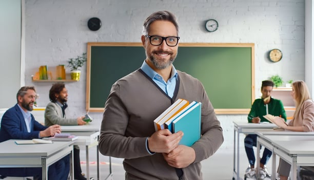 Inspiring Educator. Portrait of a Smiling Teacher with Books photo