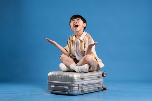 Portrait of asian boy posing on blue background photo