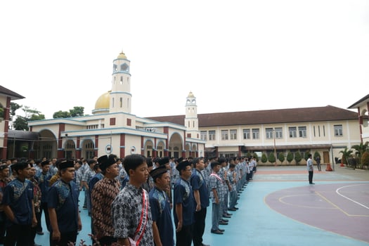 Subang, Indonesia - May 2024, Middle school, high school students and teachers taking part in a ceremony to commemorate National Education Day on the school field photo