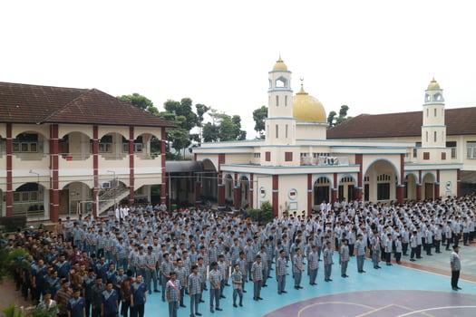 Subang, Indonesia - May 2024, Middle school, high school students and teachers taking part in a ceremony to commemorate National Education Day on the school field photo