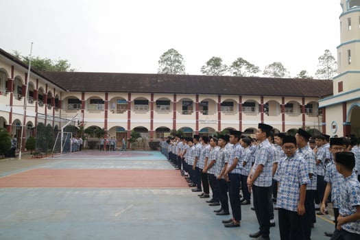Subang, Indonesia - May 2024, Middle school, high school students and teachers taking part in a ceremony to commemorate National Education Day on the school field photo