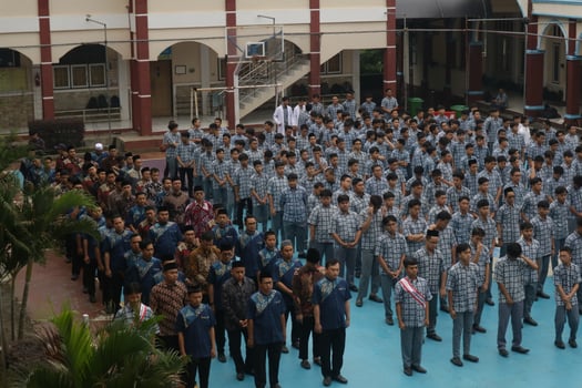 Subang, Indonesia - May 2024, Middle school, high school students and teachers taking part in a ceremony to commemorate National Education Day on the school field photo