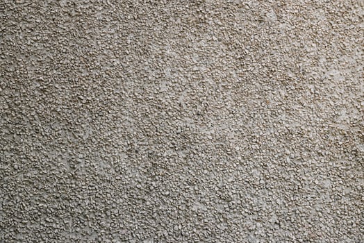 small gravel stucco wall finish texture and full-frame background photo