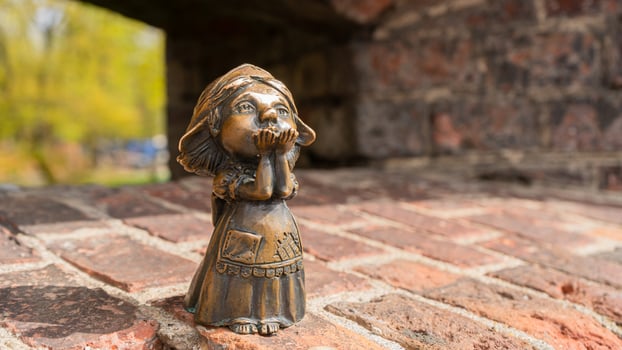 Kaliningrad, Russia - April 20, 2024. Kaliningrad, bronze sculpture of Homlin Mother, blowing kiss to everyone from the window of the Wrangel Tower photo