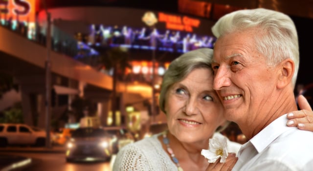 happy old couple posing against Las Vegas city photo