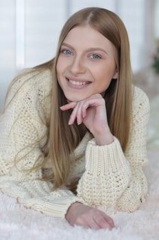 Beauty portrait. Young woman on grey wall background. photo