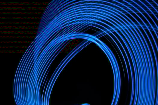 Abstract background neon electric blue glowing lines. photo