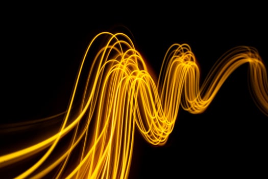 Abstract modern banner design. Glowing warm lines on black background. photo