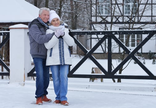 Happy senior couple at snowy winter park. photo