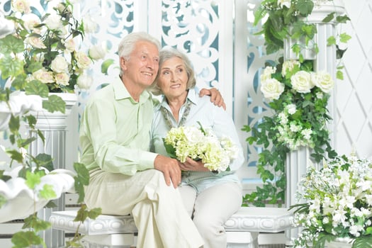 Happy beautiful senior couple together at home photo