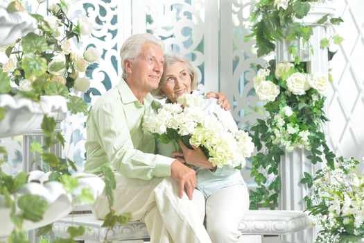 Happy beautiful senior couple together at home photo