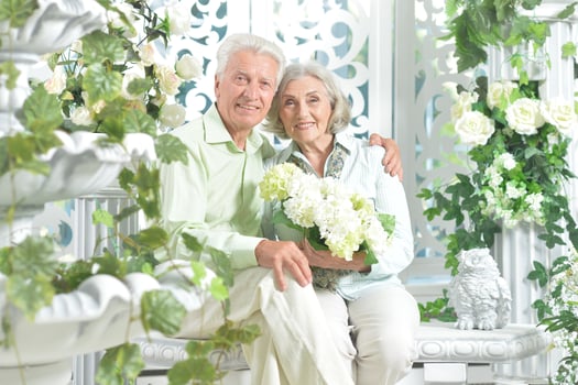 Happy beautiful senior couple together at home photo
