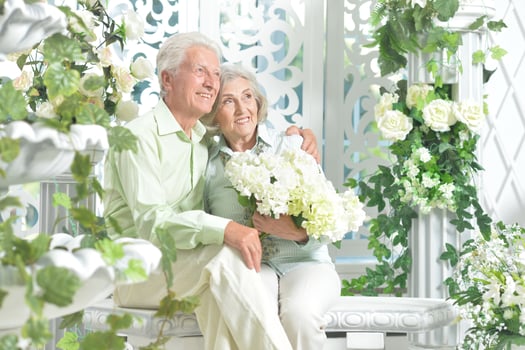 Happy beautiful senior couple posing together at home photo