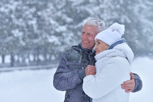 Happy senior couple walking at winter outdoors photo