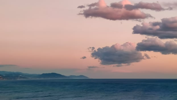 Background of pink clouds in evening sky over sea, twilight fairy sunset, copy space. photo