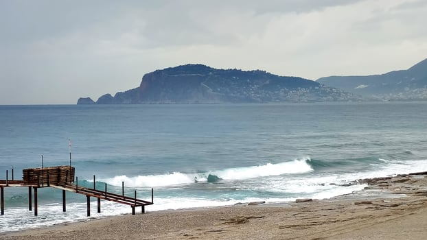 Panorama of sea coast, cloudy sky over blu sea, view from shore. photo