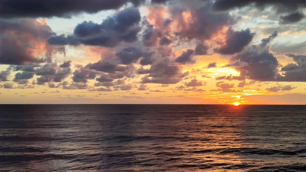 Seascape with beautiful sunset and clouds photo