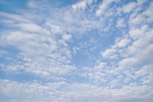 White fluffy clouds on background blue sky. photo