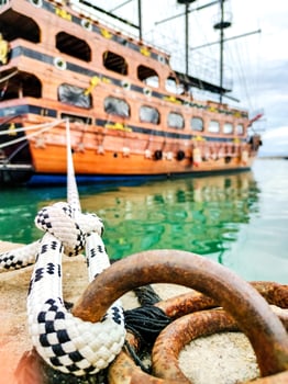 Mooring Rope Knot, Close-Up, Holding Moored Ship Near Shore. Symbol of Safety and Stability.. photo