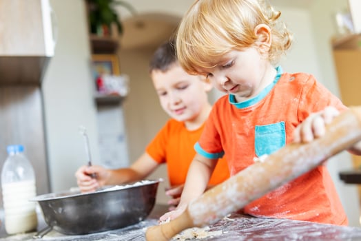 Fun family, cute kids making dough for cookies in the kitchen photo