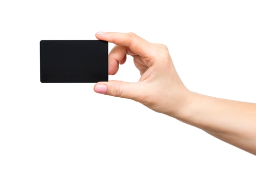Business card in female hand, closeup isolated on white background. photo