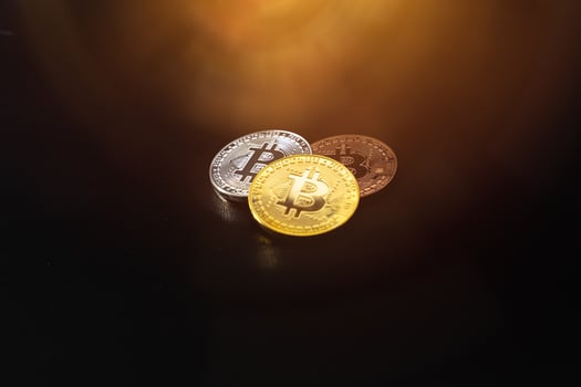 Bitcoin on a dark background. Economic crisis. photo