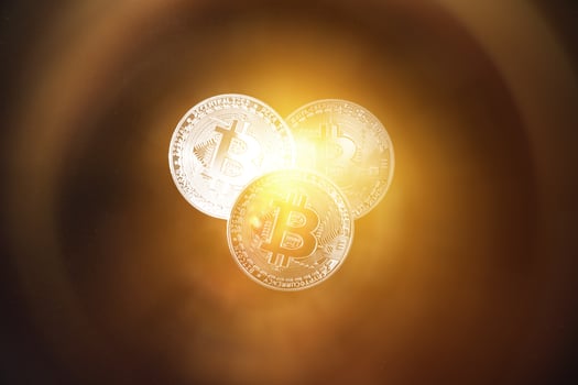 Bitcoin on a dark background. Economic crisis. photo