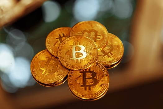 Bitcoins on a mirror background. Crypto fever. photo