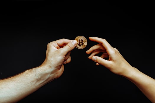 Bitcoin transfer from hand to hand photo