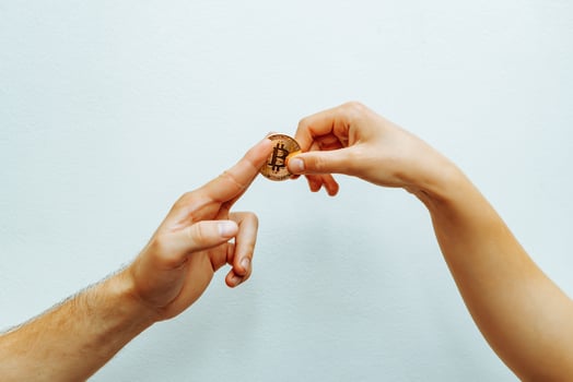 Bitcoin transfer concept from hand to hand. photo