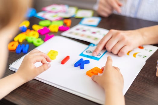 Child Learning Letters with Educational Toys photo