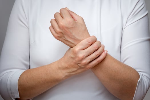 Woman hands showing wrist pain photo