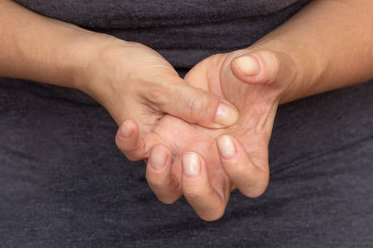 Woman hands showing numb hand photo