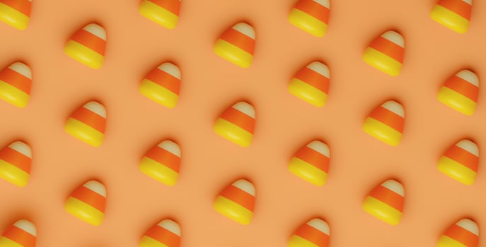 Halloween Candy Corn pattern on orange background. Holiday Hallows' Eve or Saints' Eve. copy space. 3d render. photo