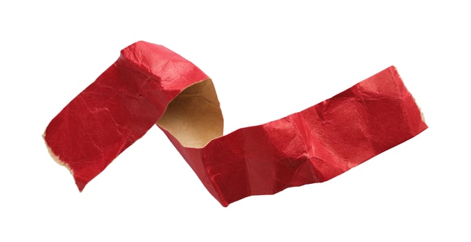 Torn paper red tape scroll cut out on white background photo