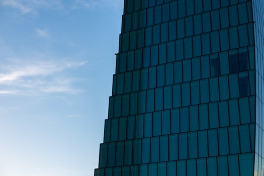 Background of facade of office building and blue sky. Milan, Italy. CityLife. Finance, economics, future concepts photo