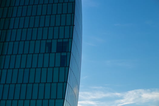 Skyscraper against the blue sky. Place for text. Glass buildings in Milan, Italy. CityLife Shopping District complex - the new commercial and residential area. Finance, economics, future concepts photo