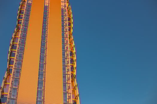 Skyscraper against the blue sky. Place for text. Glass buildings in Milan, Italy. CityLife Shopping District complex - the new commercial and residential area. Finance, economics, future concepts photo