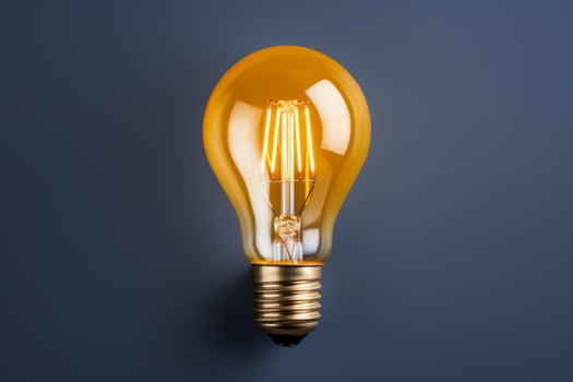 Vintage lightbulb bright light bulb edison lamp electrical thinking idea concept innovation technology symbol solution inspiration invention energy light electricity power creativity sign photo